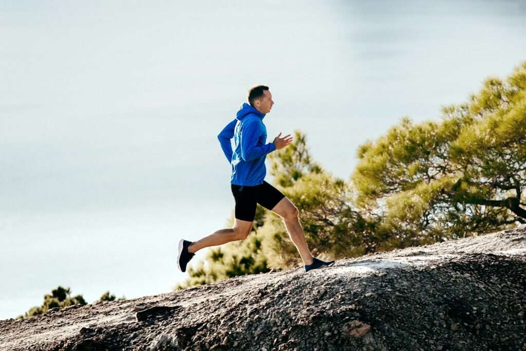 man runner in blue jacket